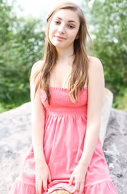 Frisky babe poses naked