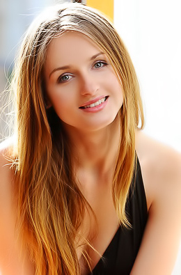 Hot blonde in black is enjoying great solo on the sofa