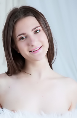 Afina Stroking The Faux Fur Against Her Beautiful Breasts And Rolling Around Languidly