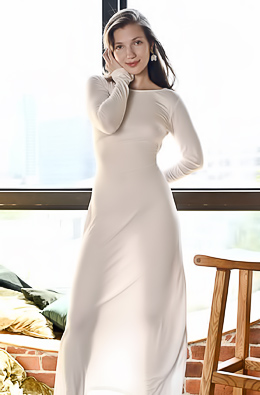 Golden Light Catches Sophie Lix Sprawled Back On Chair, Her Long Dress Hiked High