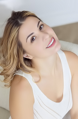 Alice Kelly Dark-eyed Siren Smiles Enticingly As The Straps Slide From Her Shoulders
