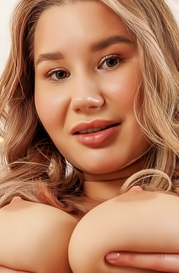 Amalia Davis Bends Forward, Anticipation Lingering as She Lifts Her Dress